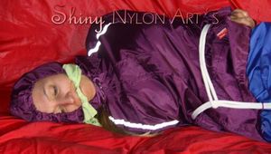 SANDRA being tied and gagged on a sofa with ropes and a clothgag wearing a sexy blue shiny nylon rain pants and a purple rain jacket (Pics)