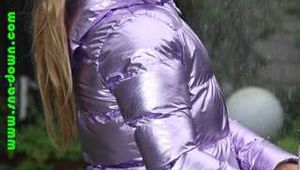 Watch Sandra taking a shower in her new purple shiny nylon down jacket 