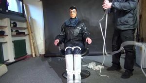Lady M bound and gagged in Rainwear, white Rubberboots and Latexhood