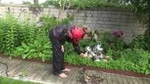 Watching sexy Sandra wearing sexy shiny nylon rainwear gardening outside (Video)