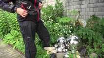 Watching sexy Sandra wearing sexy shiny nylon rainwear gardening outside (Video)