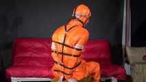 Sexy Pia wearing an oldschool orange shiny nylon rain pants and rain jacket being tied and gagged with belts and a ballgag on a chair (Video)