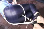 PIA tied with ropes on the sofa, gagged with a cloth gag wearing a sexy blue oldschool shiny nylon rain suit (Pics)