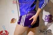 Sonja taking a shower wearing a very hot purple shiny nylon shorts and a blue rain jacket (Pics)