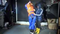 See Ronja tied and gagged by Stella in shiny nylon Rainwear and a Life Vest!