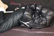 Watching sexy SONJA wearing a sexy black shiny nylon rain pants and a black shiny nylon down jacket being tied, gagged and hooded with ropes and a cloth gag on a bed (Pics) 