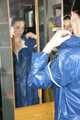 Lucy wearing sexy blue shiny nylon rainwear cleaning the mirror (Pics)