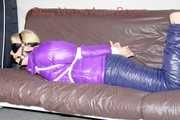 Pia tied and gagged with ropes and a ballgag with eye patches wearing a sexy crazy sensation down pants and a purple down jacket (Pics)