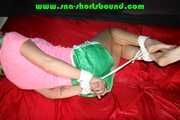 Sexy Pia being tied and gagged on a sofa with ropes and a cloth gag wearing a sexy green shiny nylon shorts (Pics)