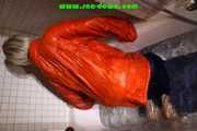 SEXY SONJA wearing a black shiny nylon rain pants and an orange big downjacket enjoying a bath (Pics)
