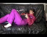 Mara wearing a sexy oldschool shiny nylon downwear combination reading and lolling on the sofa (Video)