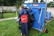 Watch Sandra in the Garden wearing a Rainskirt and Rainjacket