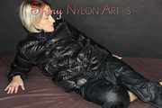 Watching sexy SONJA wearing a black rain pants and a black shiny nylon down jacket preparing bed (Pics)