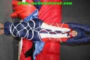 Sonja tied and gagged overhead with ropes and a ballgag wearing a sexy shiny nylon oldschool downbib (Pics)