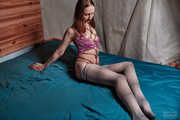 Shibari karada in pink shirt and striped pantyhose