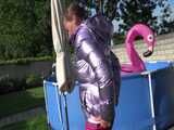 Watch Sandra enjoying her shiny nylon Downwear at a warm Summer Day in the Garden and in the Pool