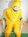 Katharina tied, gagged and hooded on a chair wearing sexy yellow rainwear (Pics)