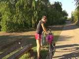 Get a Video with Sandra riding her bike enjoying her shiny nylon Shorts