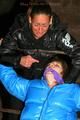 One archive girl tied and gagged by another archive girl outdoor wearing lightblue and black shiny downjackets (Pics)