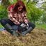 Rubber boot mistress presses slave face into manure