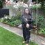 Watching Aiyana wearing a sexy black shiny nylon rainpant and a black shiny nylon down jacket trying the garden shower  (Pics)