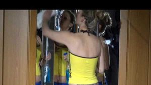 ***NEW MODEL*** Sandra wearing highheels and a sexy blue/yellow shiny nylon shorts and a yellow top during cleaning the mirror (Video)