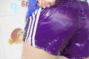 Sonja taking a shower wearing a very hot purple shiny nylon shorts and a blue rain jacket (Pics)