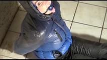 Jill bound and gagged in a shiny nylon downjacket