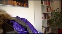 Pia tied and gagged on a blue sofa wearing a down skirt and a shiny nylon rain jacket (Video)