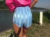 Watch Chloe enjoying her shiny nylon Shorts outside at a sunny Day