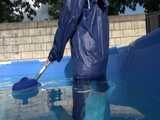 Watch Chloe cleaning the Pool in her shiny nylon Rainwear