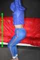 Sexy Sonja being tied and gagged overhead with ropes wearing a sexy blue shiny nylon pants and a jacket (Pics)