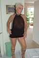 Blonde mature Claudia stipping out of a black dress