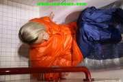 SEXY SONJA wearing a black shiny nylon rain pants and an orange big downjacket enjoying a bath (Pics)