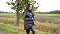 Miss Amira in blue Hunter rain jacket and patent leggings