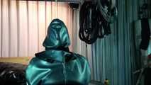 Slave in Rubber Cape