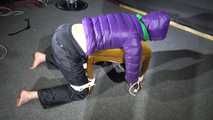 Watching Sonja wearig a sexy blue rainpant and a purple down jacket being tied, gagged and hooded on a stool with ropes and a cloth gag (Video)