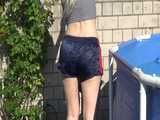 Watch Chloe enjoying her shiny nylon Shorts outside at a sunny Day