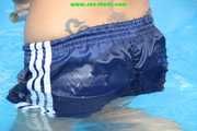 Watch Sandra cleaning the pool wearing a shiny nylon Shorts