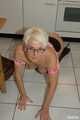 Blonde MILF Claudia strips in the kitchen