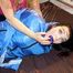 Jill tied, gagged and hooded on bed wearing a supersexy supershiny lightblue downwear (Pics)