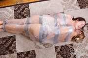 Bekki and Kelly - Sisters are taped and wrapped together face to face