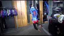 Sonja tied with ropes overhead and gagged with a clothgag wearing sexy black leather pants with a red shiny nylon shorts over it and a special blue down jacket (Video)