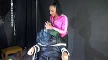 Sexy Ajyana being tied, gagged, hooded and dominated by Stella wearing sexy shiny nylon rainwear on a hairdresser´s chair Part 2 of 2 (Video)