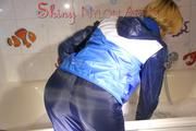 Sonja wearing a super sexy shiny nylon rain jacket and rain pants while taking a foam bath (Pics)