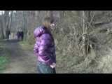 Alina wearing a jeans over a sexy shiny nylon shorts and a purple down jacket strolling on a lake (Video)