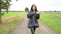 Miss Amira in blue Hunter rain jacket and patent leggings