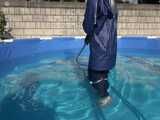 Watch Chloe cleaning the Pool in her shiny nylon Rainwear