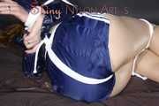***RONJA*** being tied and gagged on a sofa with ropes and a clothgag wearing a sexy blue shiny nylon shorts and a rainjacket (Pics)