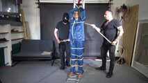 Ms ungeniert tied, gagged, suspended ind a shiny nylon Rainsuit and finally bullwhipped